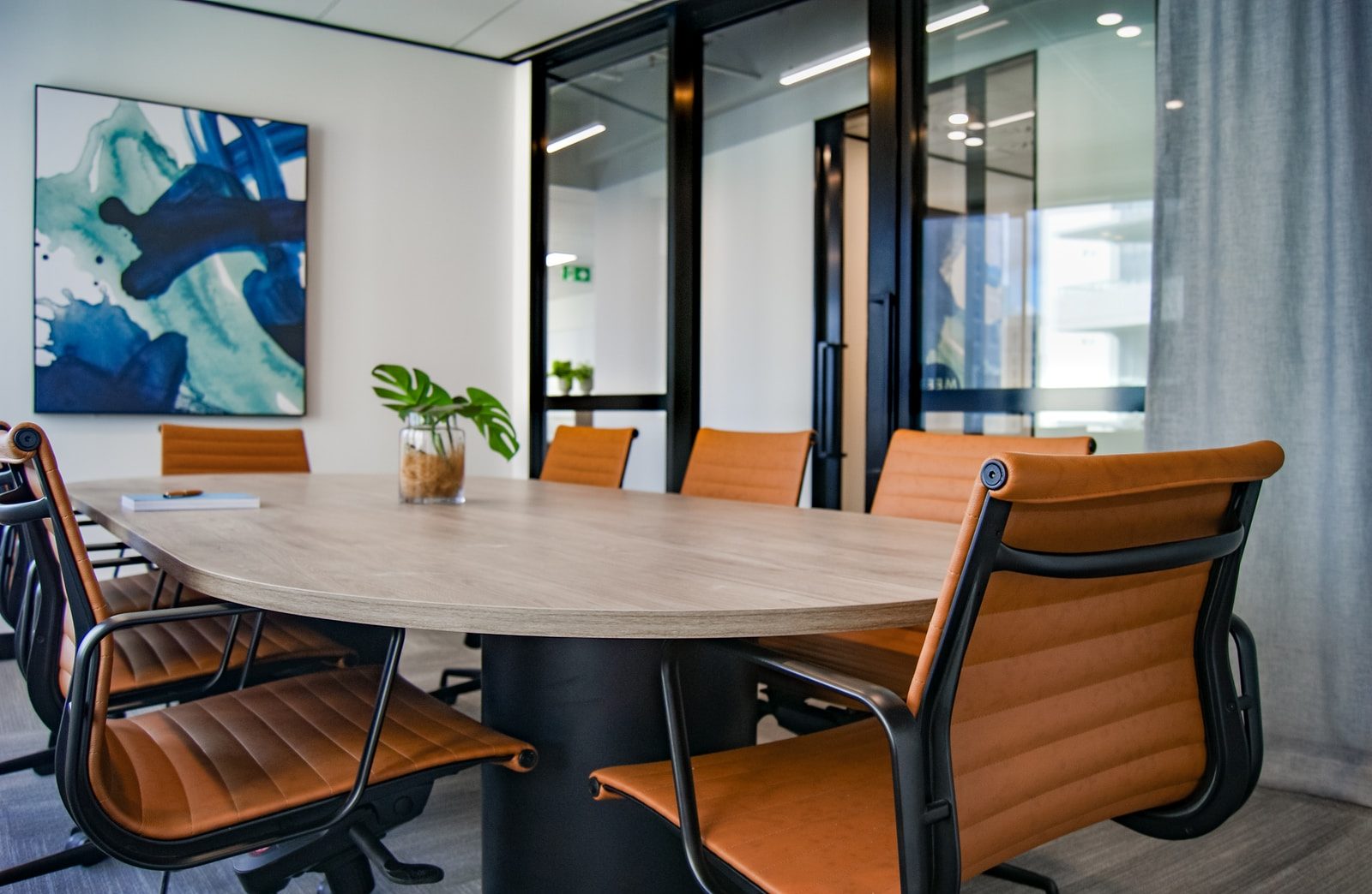 brown wooden 9-piece office table and chairs